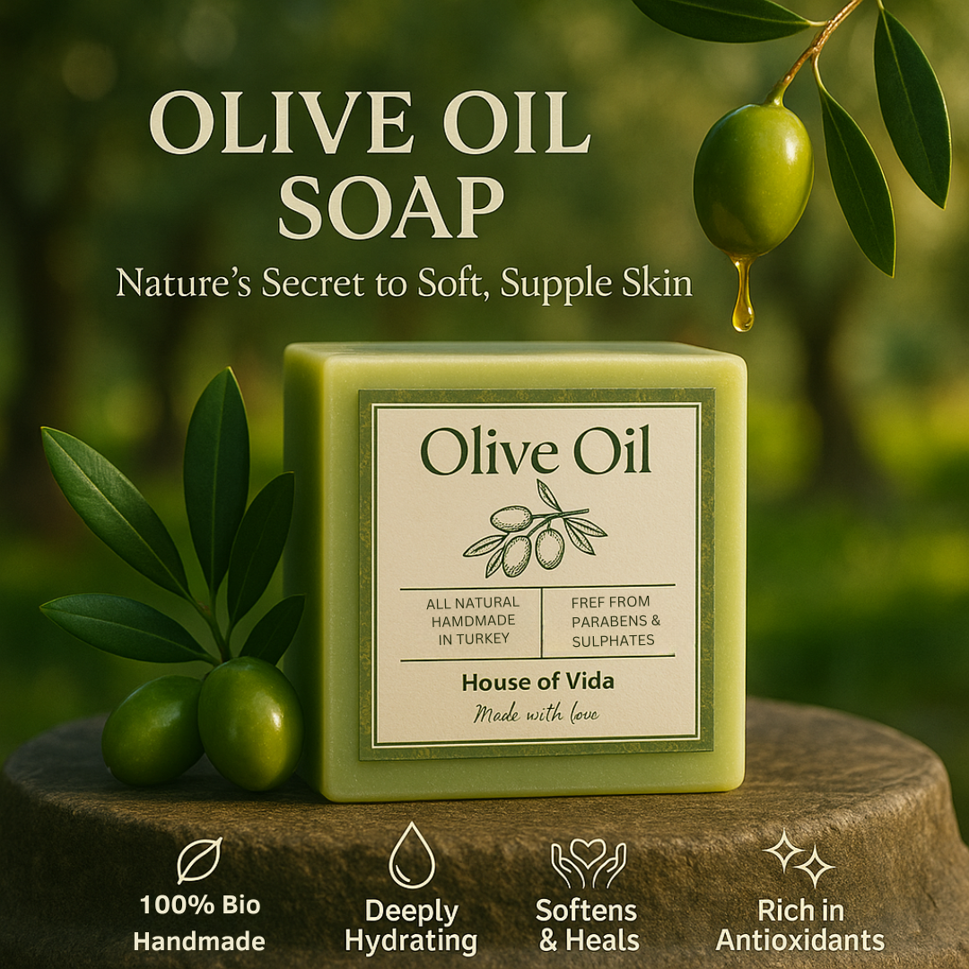 Olive Oil soap with olive leaves on a wooden surface and green background