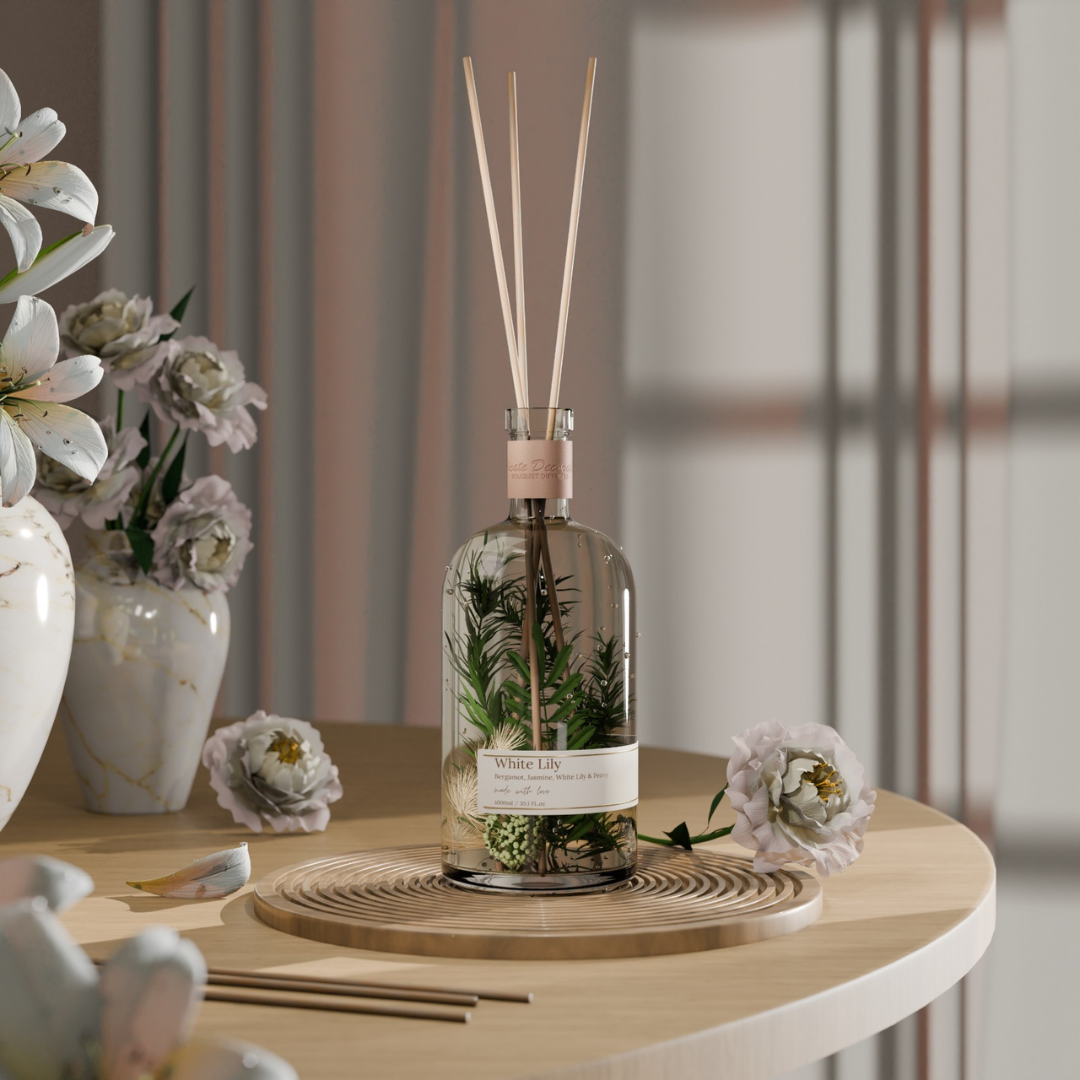 Reed diffuser bottle with floral design on a wooden table