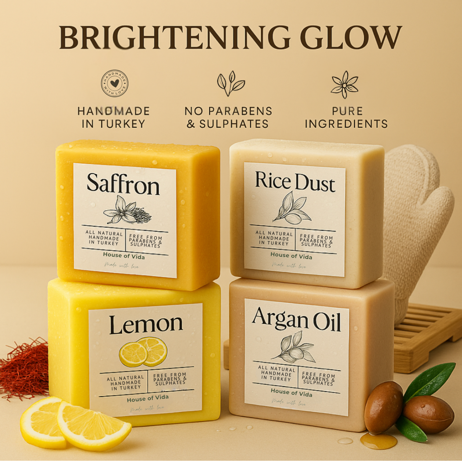 Four handmade soaps labeled Saffron, Lemon, Rice Dust, and Argan, with an eco-friendly soap holder and a double-sided hemp exfoliating shower glove. The soaps are presented with their respective key ingredients, such as saffron, lemon, rice dust, and argan oil, and benefits like brightening, exfoliating, and nourishing.
