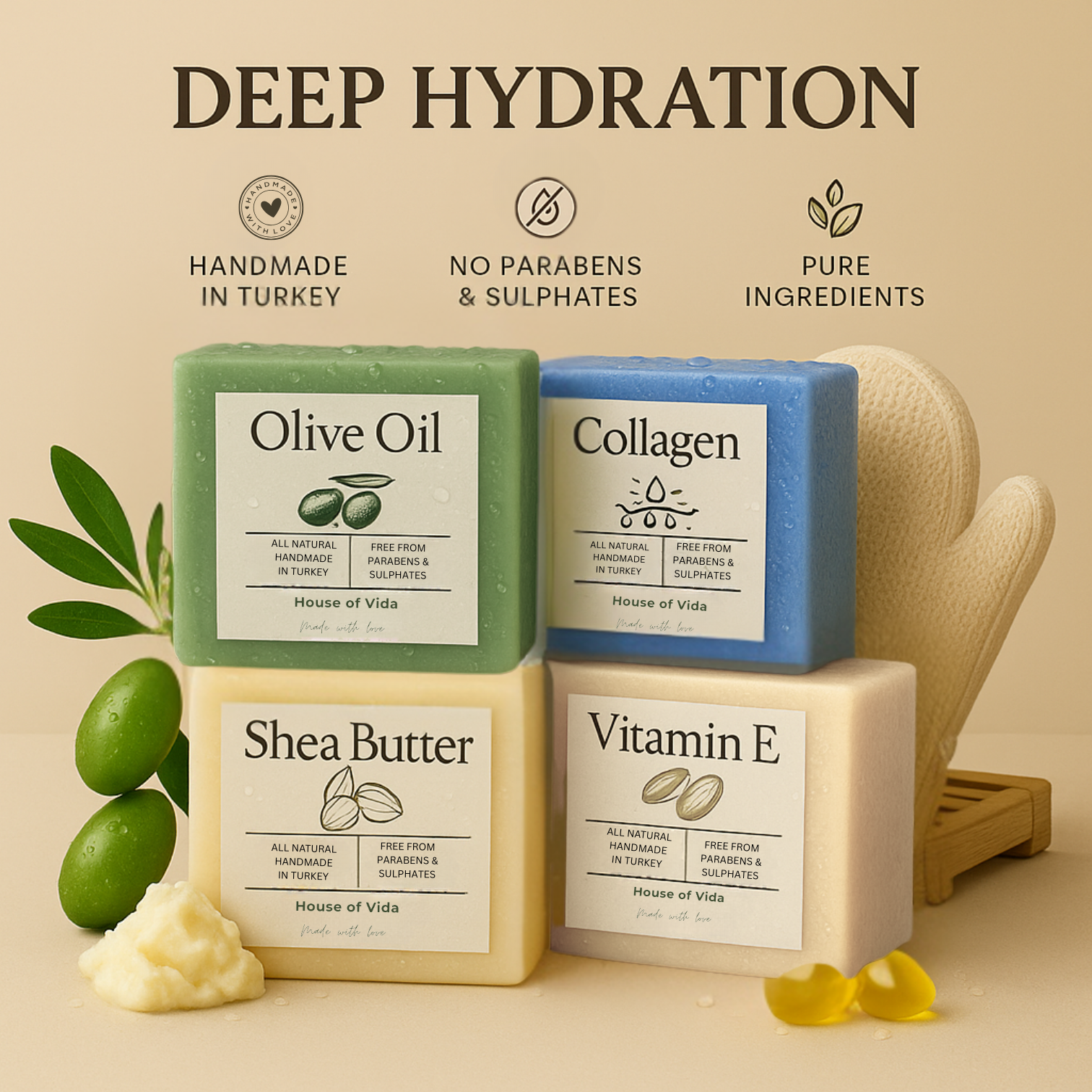 A set of four handmade soaps labeled Olive Oil, Shea Butter, Collagen, and Vitamin E with corresponding ingredients displayed around them, such as olives, shea butter, and a hemp exfoliating glove. The soaps are marketed as hydrating and made with natural ingredients.