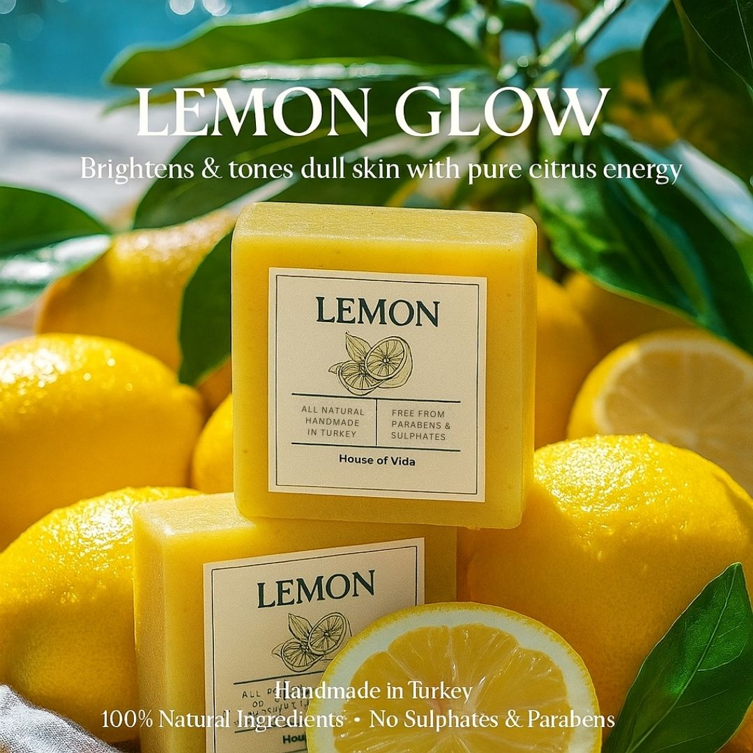 Yellow lemon-themed soap bars with 'Lemon Glow' branding on a background of lemons and leaves.