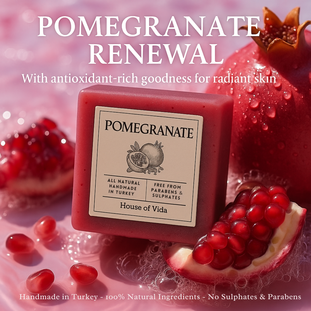 Pomegranate soap with pomegranate seeds and a pink background