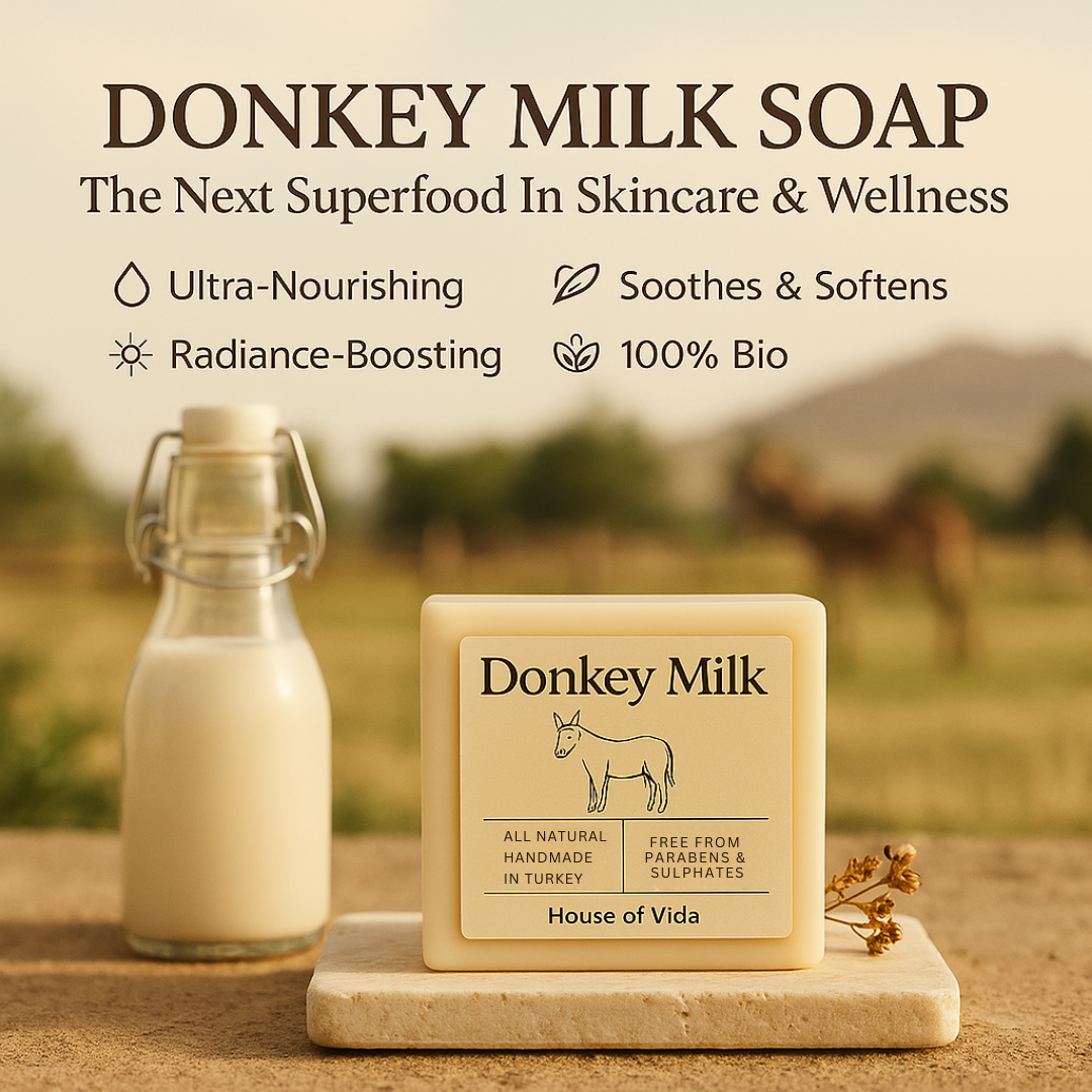 Donkey milk soap with a bottle of donkey milk on a blurred background of donkeys.