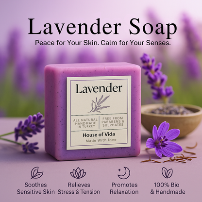 Lavender soap bar with packaging featuring lavender flowers and text on a blurred lavender field background.