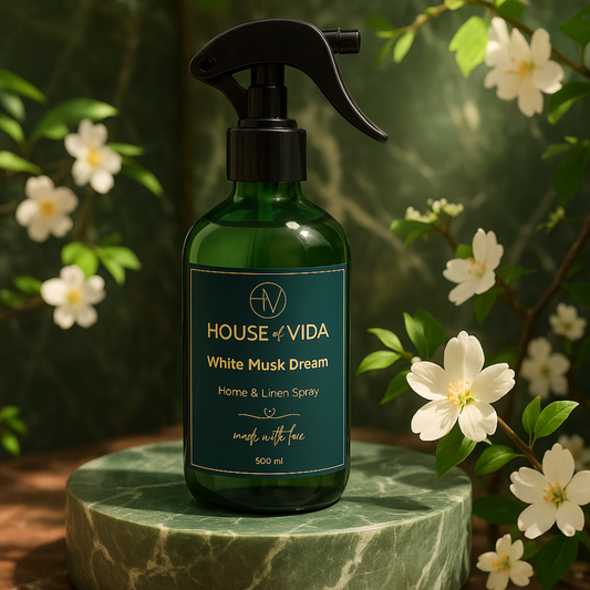 White Musk Dream Home & Linen Spray – 500ML luxury fabric mist with soft white musk, vanilla, and amber. Elegant clear bottle design.
